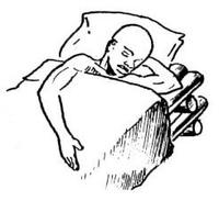 Une personne qui dort dans un lit